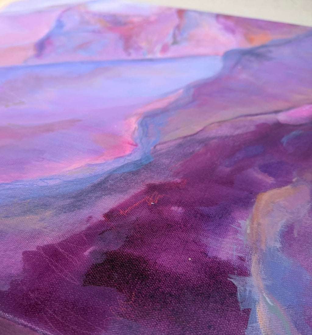 Angled close-up of The View From My Latest Summit: a pink-edged ridge drops into textured deep purple valleys under misty lavender peaks.