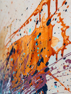 Close-up of I Have My Own Gravity: bold orange paint splashes with flung drips of navy, turquoise and lilac across pale canvas.