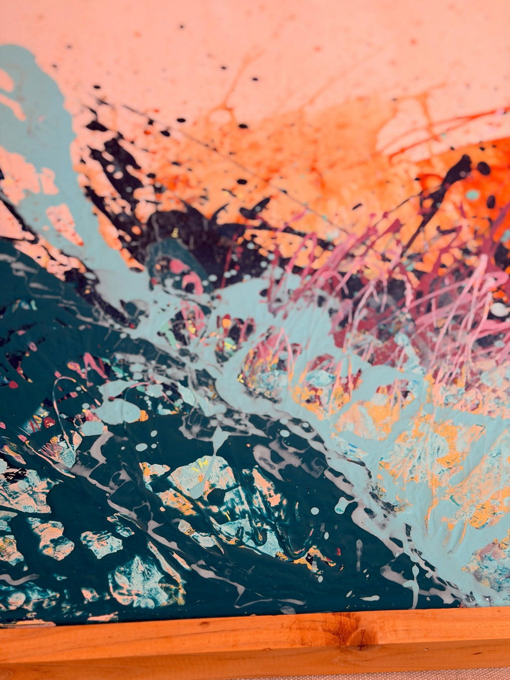 Close-up of I Have My Own Gravity showing a wave of dark teal and pale aqua splatter rising into peach and orange.