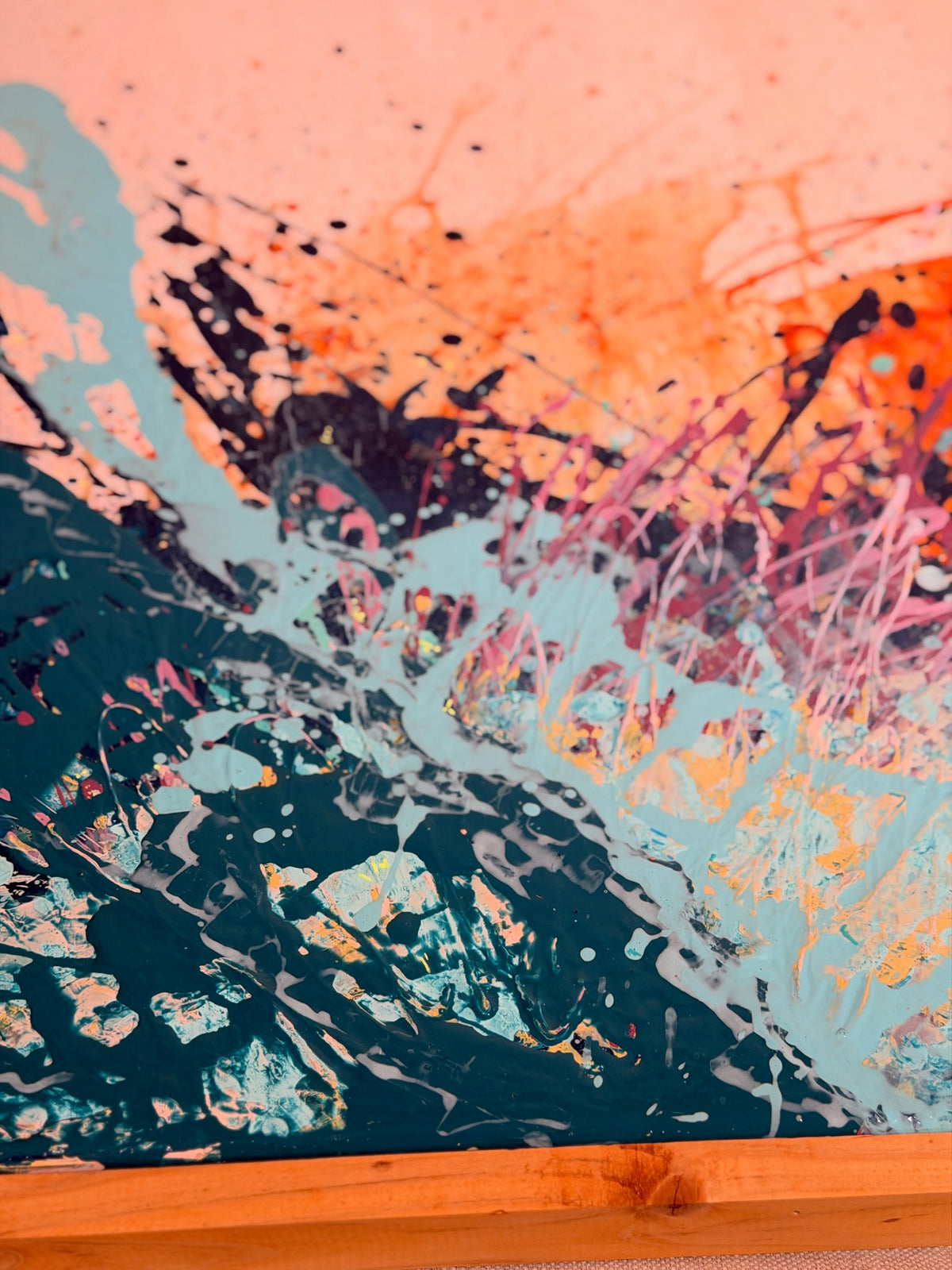 Close-up of I Have My Own Gravity showing a wave of dark teal and pale aqua splatter rising into peach and orange.