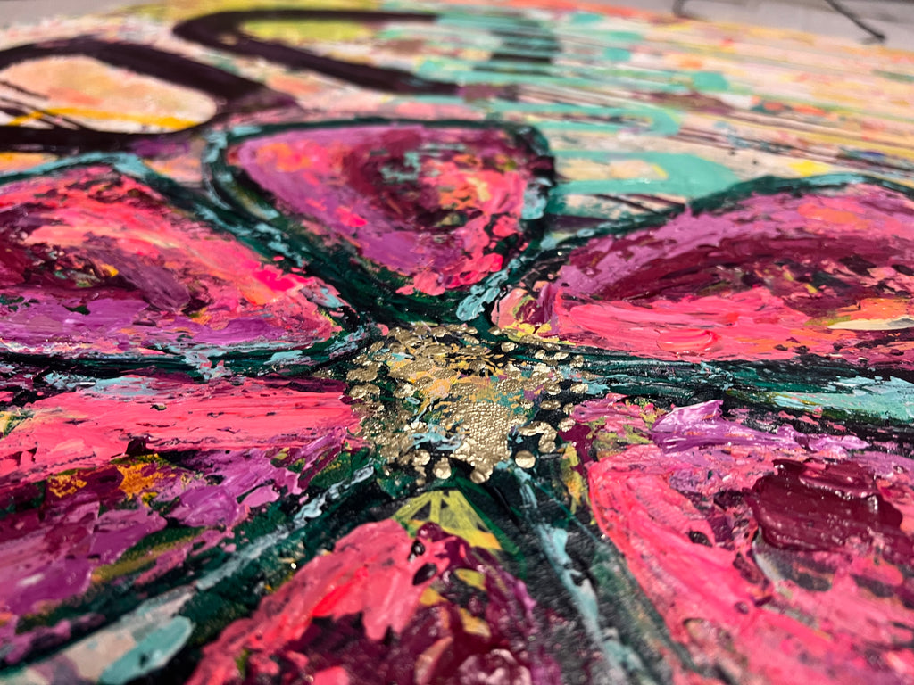 Close-up of In Bloom: thick, glossy magenta and pink petals outlined in dark green around a shimmering gold-flecked center.