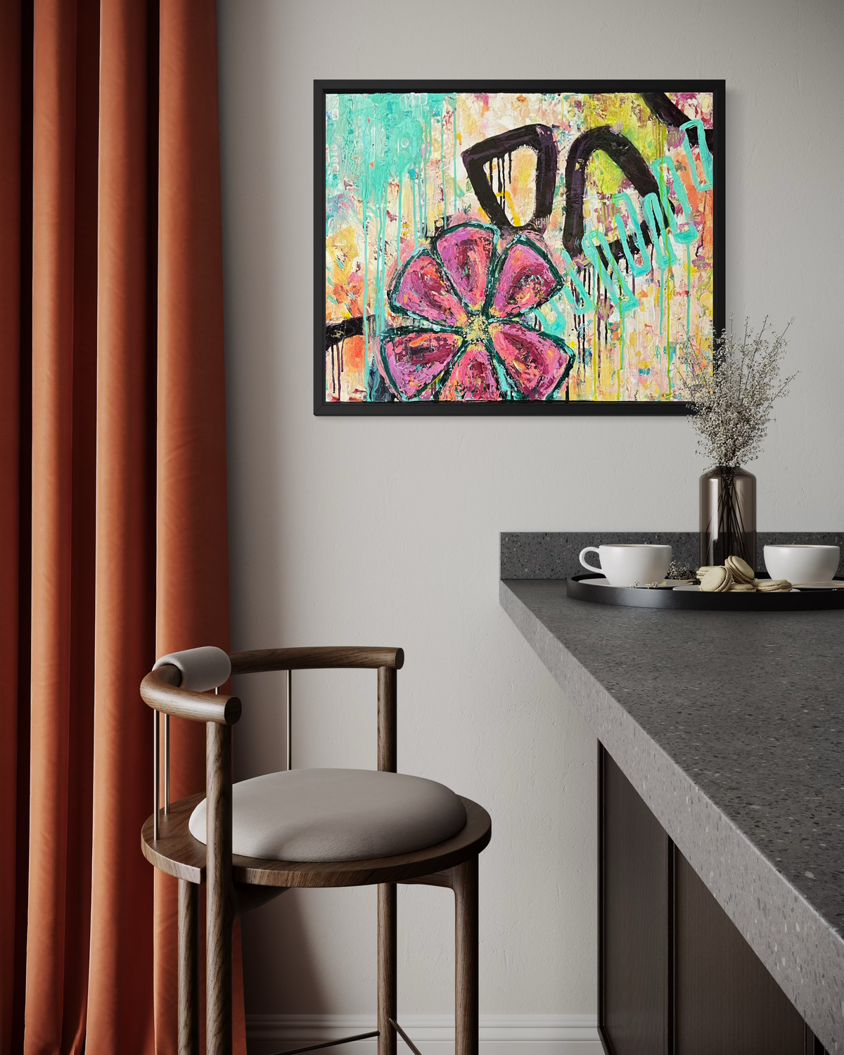 In Bloom, in mixed media on stretched canvas: a big magenta flower with a gold center over drippy turquoise, yellow and black marks, framed in black beside a kitchen counter.