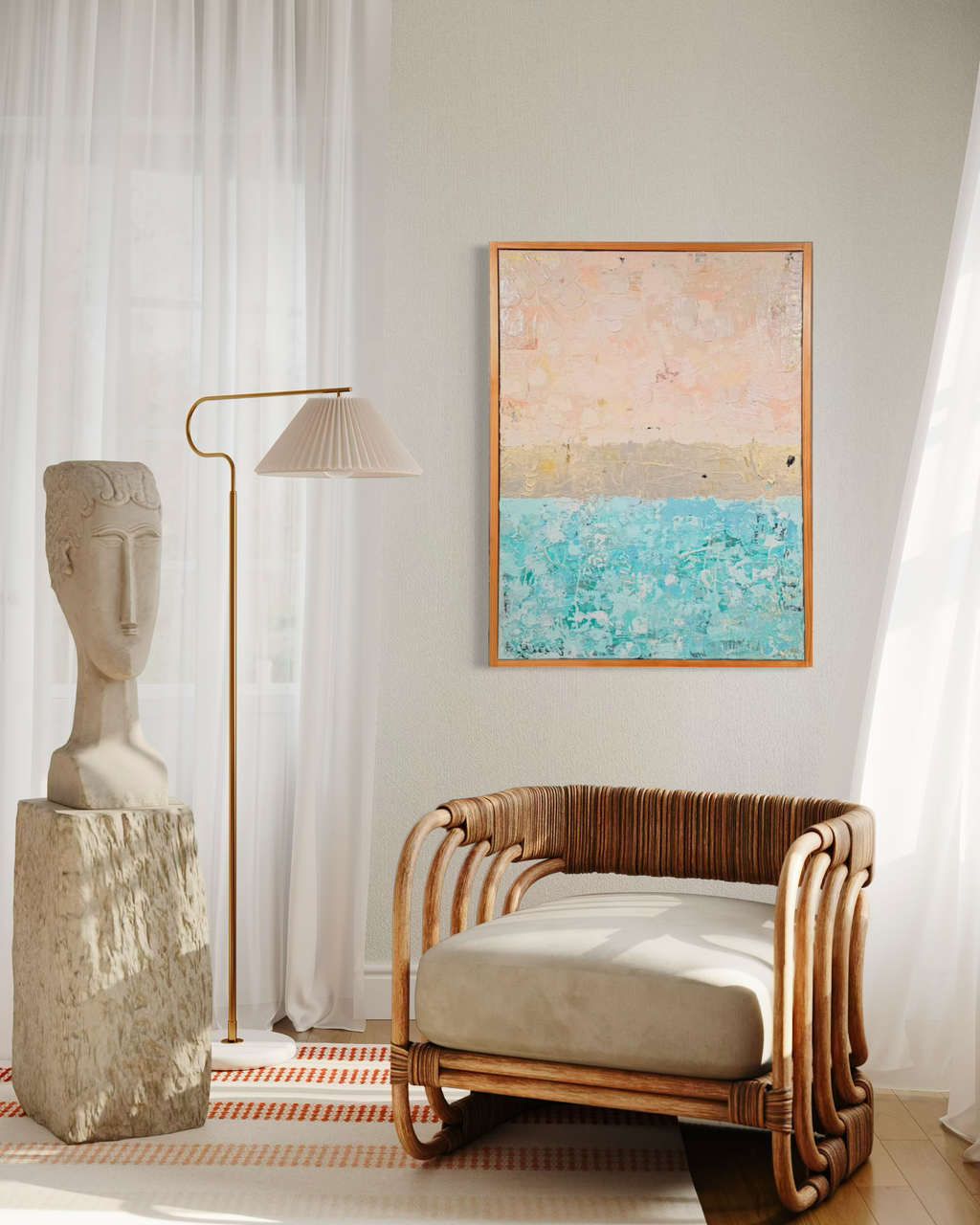 The Money Keeps Us Divided hanging in a sunny corner above a rattan chair beside a stone face sculpture and floor lamp.