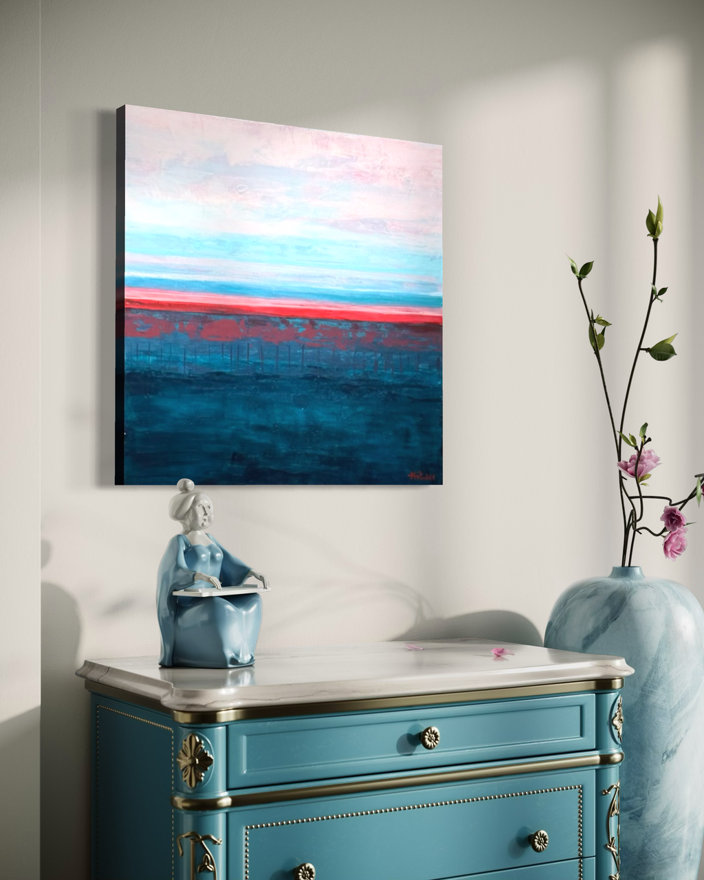 Rest in Your Peace hanging above a turquoise dresser with a blue vase of blossoms, its calm pink sky and dark teal sea meeting at a coral line.