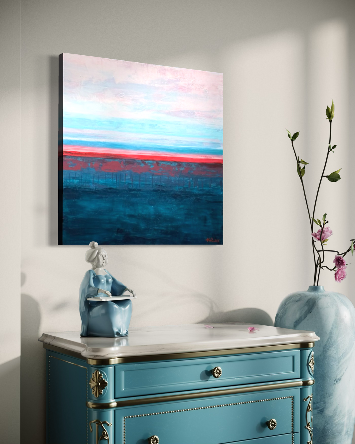 Rest in Your Peace hanging above a turquoise dresser with a blue vase of blossoms, its calm pink sky and dark teal sea meeting at a coral line.