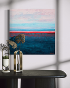 Rest in Your Peace, a square seascape in acrylic on stretched canvas: a pale pink and sky-blue horizon over textured deep teal water, split by a thin coral line, above a black console.