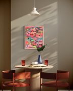 Pretty Girls Walk, a small abstract in mixed media on stretched canvas: thick coral, pink, turquoise and lime paint dabs in a natural wood frame, in a sunlit dining nook.