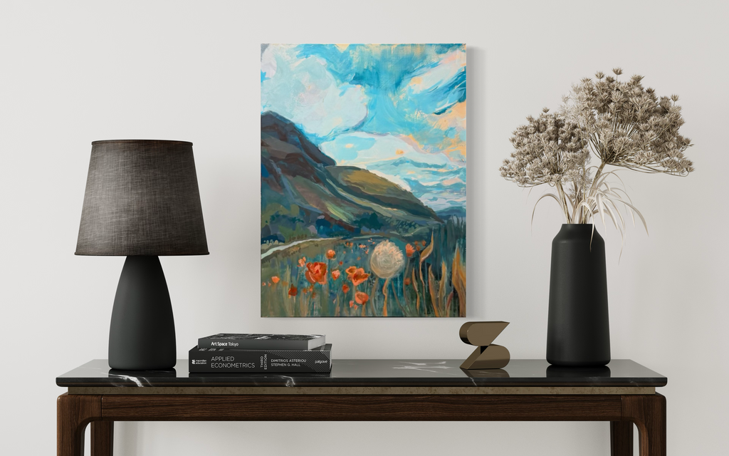 My Once Obliterated Self-Esteem shown above a dark console between a black lamp and dried flowers: a teal meadow, orange poppies and a dandelion beneath a swirling sky.