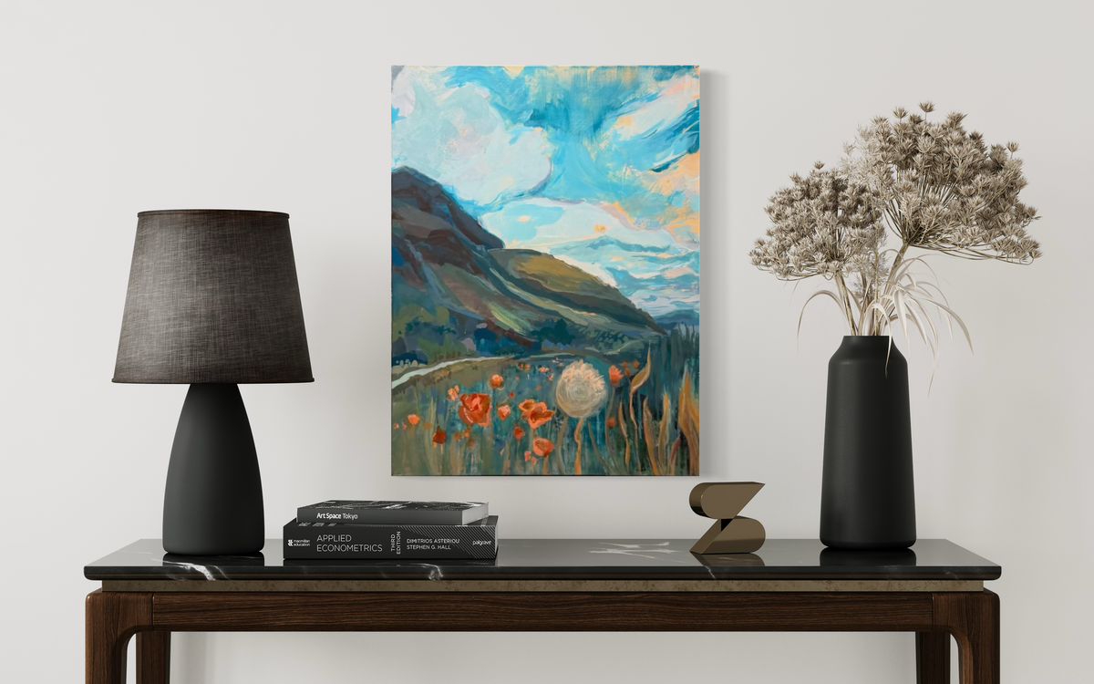 My Once Obliterated Self-Esteem shown above a dark console between a black lamp and dried flowers: a teal meadow, orange poppies and a dandelion beneath a swirling sky.